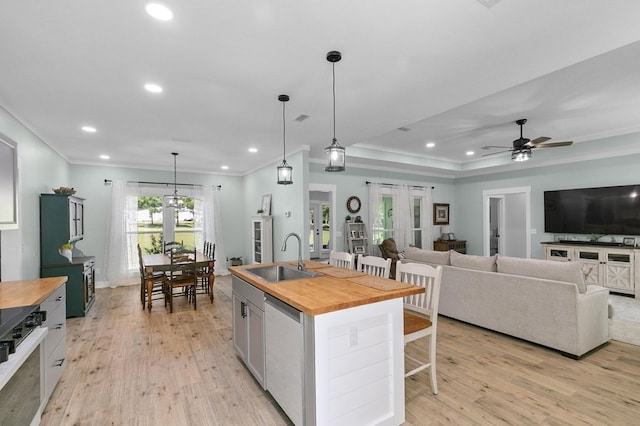 3155 Eddins Rd, Dothan, AL 36301 - kitchen with wooden counters, dishwashing machine, a breakfast bar area, recessed lighting, and ornamental molding