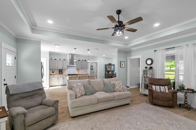 3155 Eddins Rd, Dothan, AL 36301 - living room with light wood-style floors, a ceiling fan, recessed lighting, a raised ceiling, and crown molding