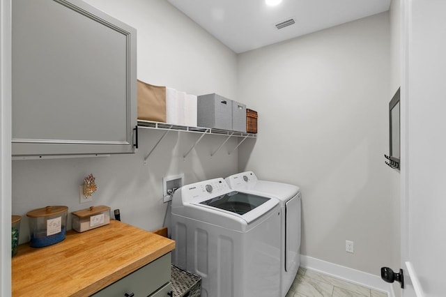 3155 Eddins Rd, Dothan, AL 36301 - laundry area featuring independent washer and dryer and light marble finish flooring