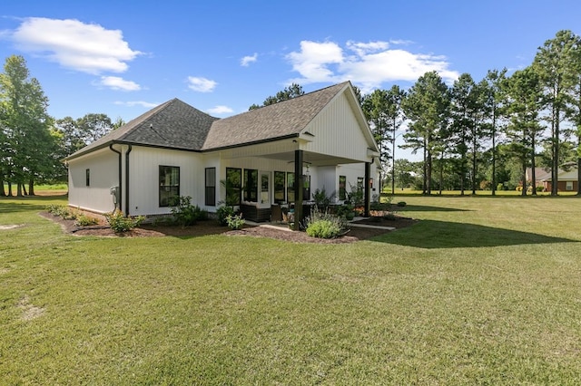 3155 Eddins Rd, Dothan, AL 36301 - back of property with a shingled roof, a yard, and a patio area