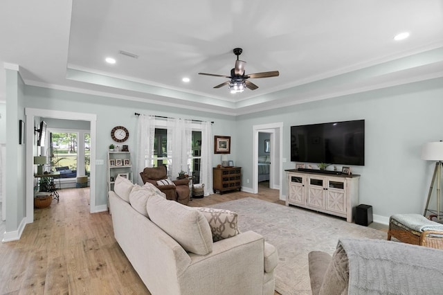 3155 Eddins Rd, Dothan, AL 36301 - living area featuring a tray ceiling, ceiling fan, crown molding, light wood-type flooring, and recessed lighting