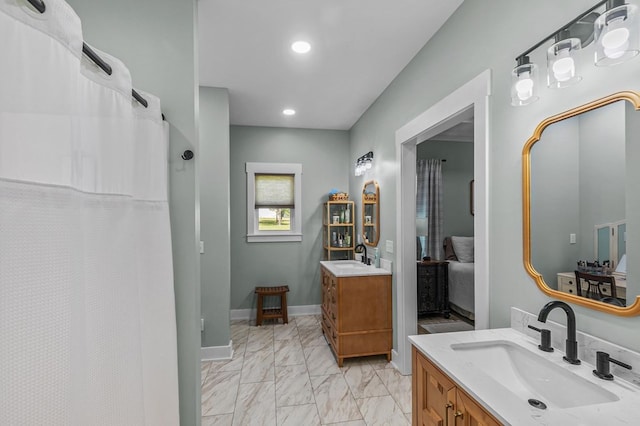 3155 Eddins Rd, Dothan, AL 36301 - full bath featuring marble look tiles, two vanities, recessed lighting, ensuite bathroom, and curtained shower