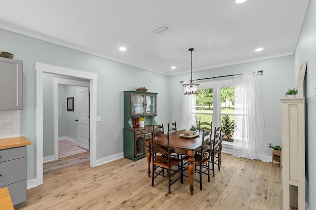 3155 Eddins Rd, Dothan, AL 36301 - dining room with light wood-style flooring, ornamental molding, and recessed lighting