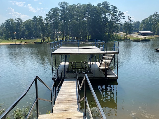 dock area with a water view