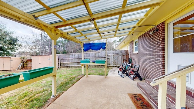 view of patio featuring fence