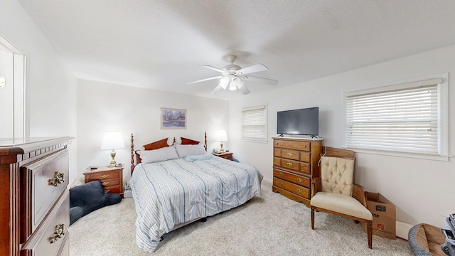 carpeted bedroom with a ceiling fan