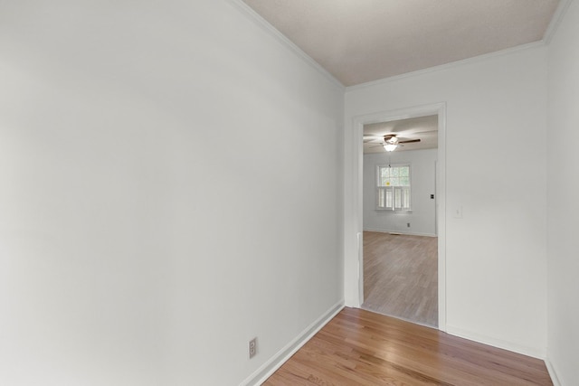 1700 Randall Rd, Dothan, AL 36303 - spare room featuring light wood-style flooring, ornamental molding, baseboards, and a ceiling fan