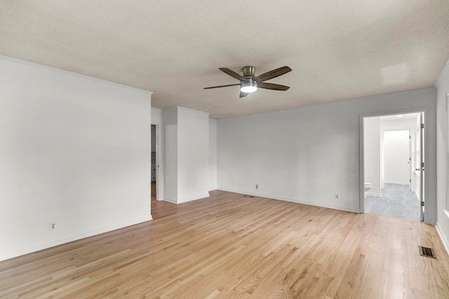 1700 Randall Rd, Dothan, AL 36303 - empty room featuring a ceiling fan, light wood-style flooring, baseboards, and a textured ceiling