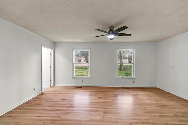 1700 Randall Rd, Dothan, AL 36303 - spare room with light wood finished floors, a textured ceiling, ceiling fan, crown molding, and baseboards