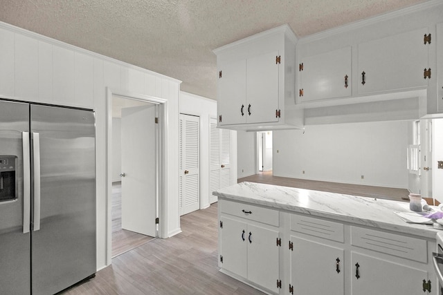 1700 Randall Rd, Dothan, AL 36303 - kitchen featuring stainless steel fridge with ice dispenser, light wood-type flooring, a textured ceiling, white cabinets, and crown molding