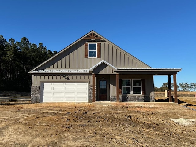 view of front facade with covered porch and a garage