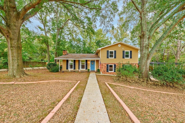 split level home with covered porch