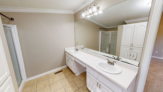 bathroom featuring tile patterned flooring, crown molding, walk in shower, and vanity