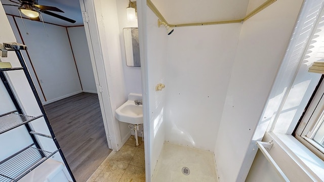 bathroom with ceiling fan and sink