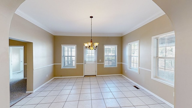 unfurnished dining area featuring a healthy amount of sunlight, a chandelier, and light tile patterned flooring