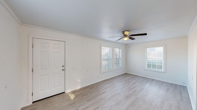 empty room with ceiling fan, ornamental molding, and light hardwood / wood-style floors