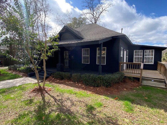 view of front of house with a wooden deck