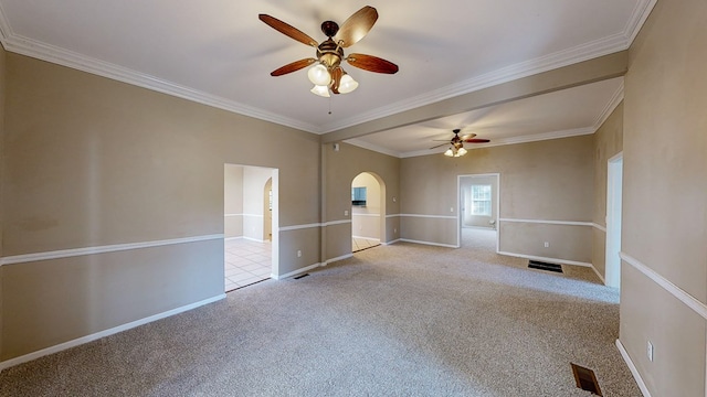 carpeted empty room featuring ceiling fan and ornamental molding