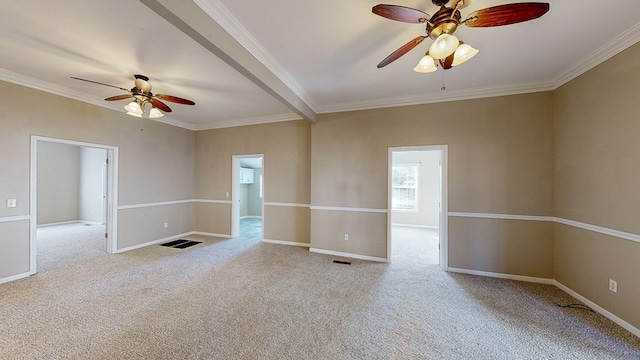 empty room with ceiling fan, light colored carpet, and crown molding