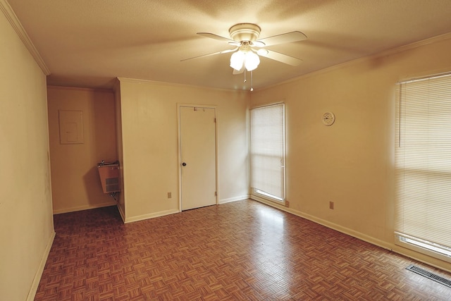 unfurnished bedroom featuring ceiling fan, crown molding, dark parquet floors, and a textured ceiling