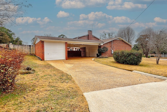 single story home featuring a carport and a front lawn