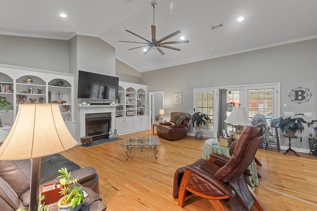 living room with high vaulted ceiling, light hardwood / wood-style floors, built in features, and ceiling fan