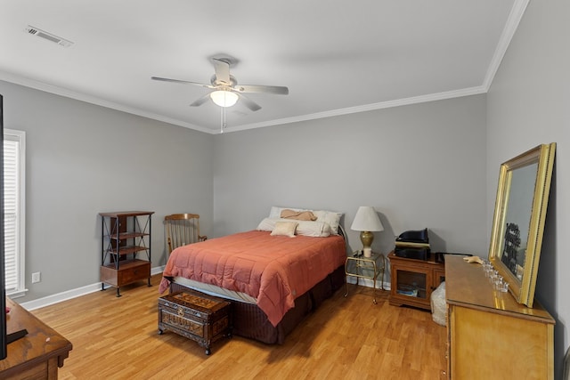 bedroom with ceiling fan, hardwood / wood-style floors, and ornamental molding