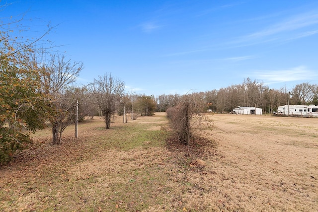 view of yard with a rural view