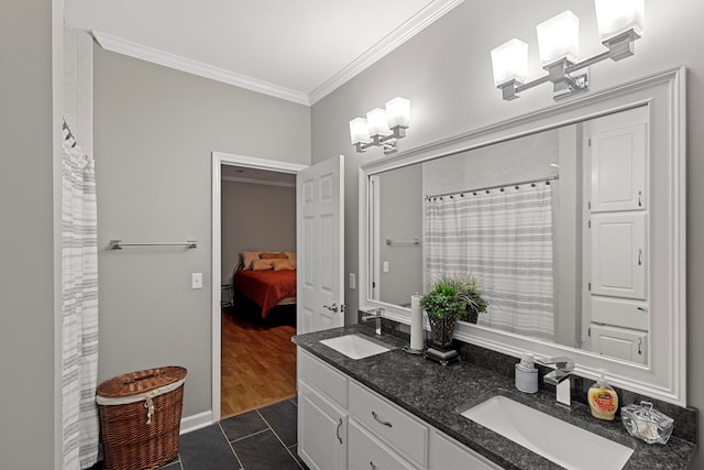 bathroom featuring tile patterned flooring, vanity, crown molding, and a chandelier