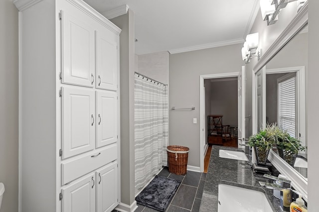 bathroom featuring a shower with curtain, crown molding, and vanity