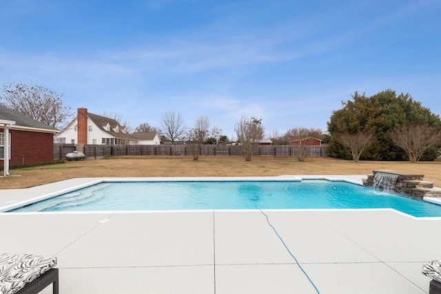 view of pool with a lawn, a patio area, and pool water feature