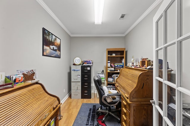 office with crown molding and light hardwood / wood-style floors