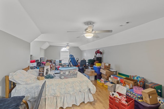 bedroom with hardwood / wood-style floors, ceiling fan, and lofted ceiling