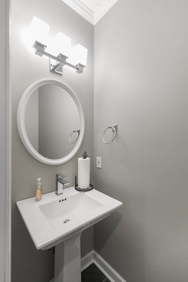 bathroom with tile patterned floors and crown molding