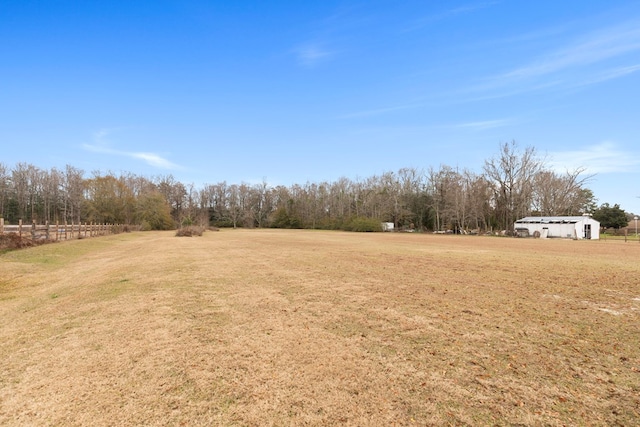 view of yard with a rural view