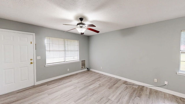 806 County Road 23, Skipperville, AL 36374 - unfurnished room with a ceiling fan, light wood-type flooring, and a textured ceiling