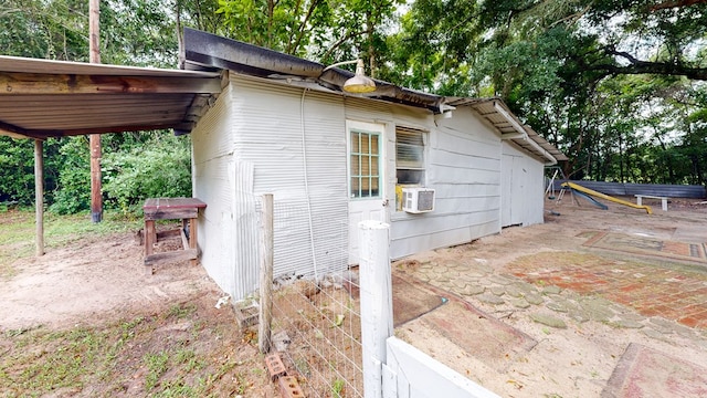 806 County Road 23, Skipperville, AL 36374 - view of property exterior featuring cooling unit, a patio area, and view of scattered trees
