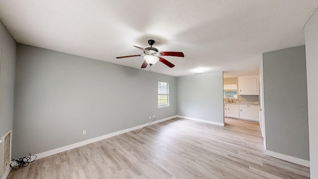 806 County Road 23, Skipperville, AL 36374 - spare room featuring a ceiling fan, light wood-style flooring, and a textured ceiling
