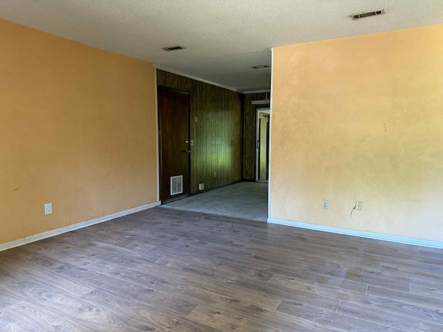 230 Sharon Ct, Ozark, AL 36360 - empty room featuring wood finished floors and a textured ceiling