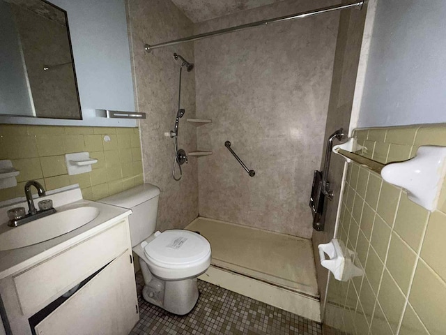 230 Sharon Ct, Ozark, AL 36360 - bathroom with tile walls, a tile shower, vanity, and tile patterned flooring