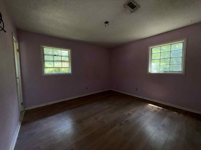 230 Sharon Ct, Ozark, AL 36360 - spare room with wood finished floors and a textured ceiling