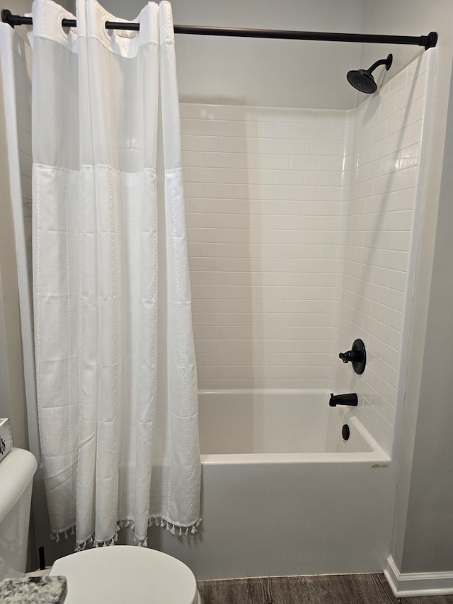526 Ridgeland Rd, Dothan, AL 36301 - bathroom featuring toilet, shower / bathtub combination with curtain, and wood finished floors