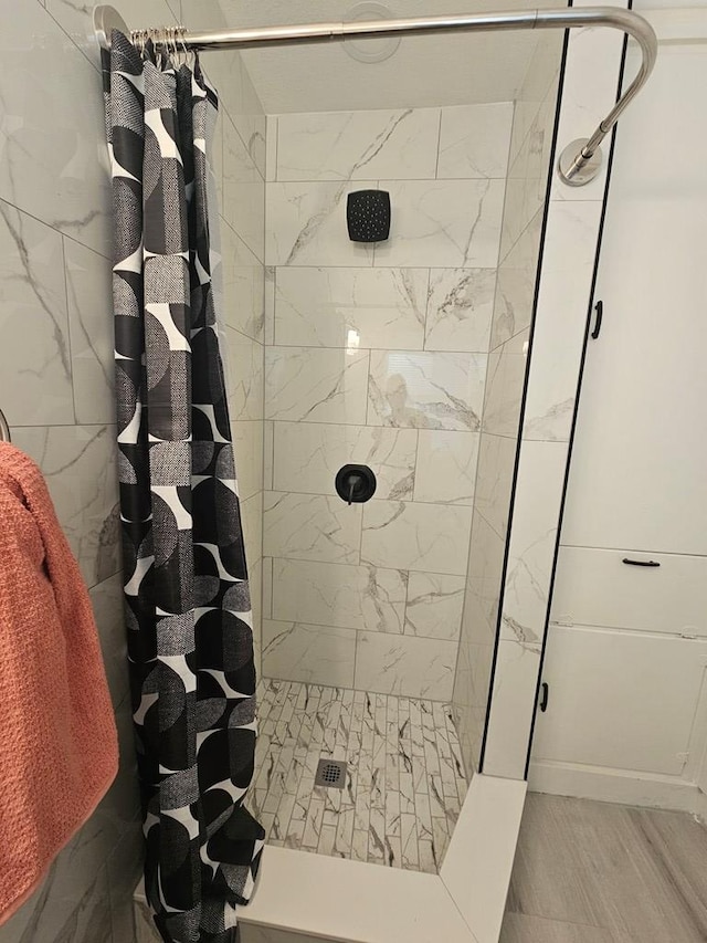 full bathroom with a stall shower