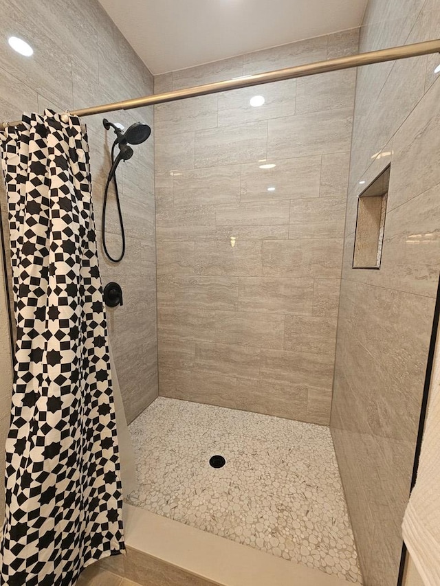 bathroom with a shower stall