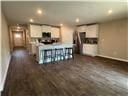 205 Mairead Dr, Dothan, AL 36301 - kitchen with recessed lighting, dark wood-style flooring, and white cabinets