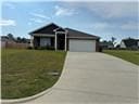 205 Mairead Dr, Dothan, AL 36301 - view of front facade featuring concrete driveway, an attached garage, and a front lawn