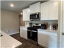 205 Mairead Dr, Dothan, AL 36301 - kitchen with appliances with stainless steel finishes, light countertops, and white cabinets