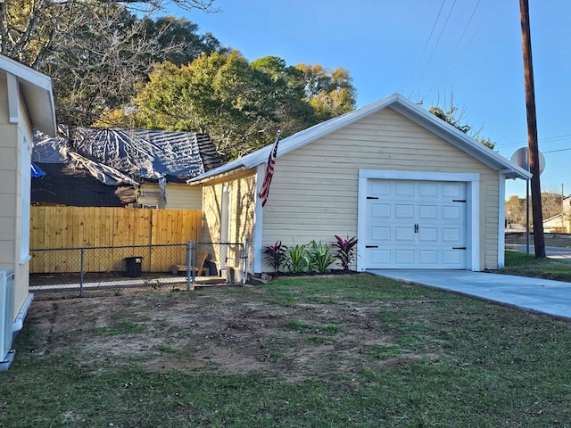 garage featuring a lawn