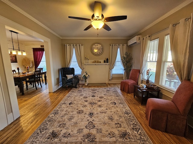 living area featuring ceiling fan, a wealth of natural light, crown molding, and a wall unit AC