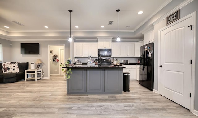 370 Airport Rd, Slocomb, AL 36375 - kitchen with black appliances, white cabinetry, dark countertops, light wood-type flooring, and ornamental molding